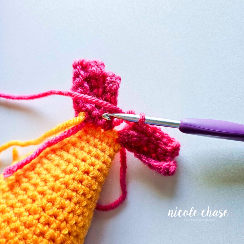The single crochet stitches of R3 of the tail fin top for the fish.