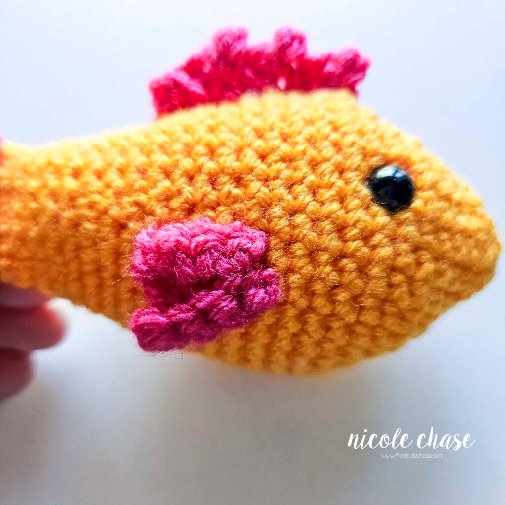 A view of the side fin on the opposite side of the crochet fish.
