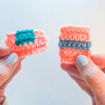 Two crocheted swatches demonstrating how to change yarn colors in crochet, held up against a white background.