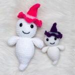 Two crocheted amigurumi ghosts named Gilbert wearing witch hats, shown in plush white chenille yarn and worsted weight yarn.