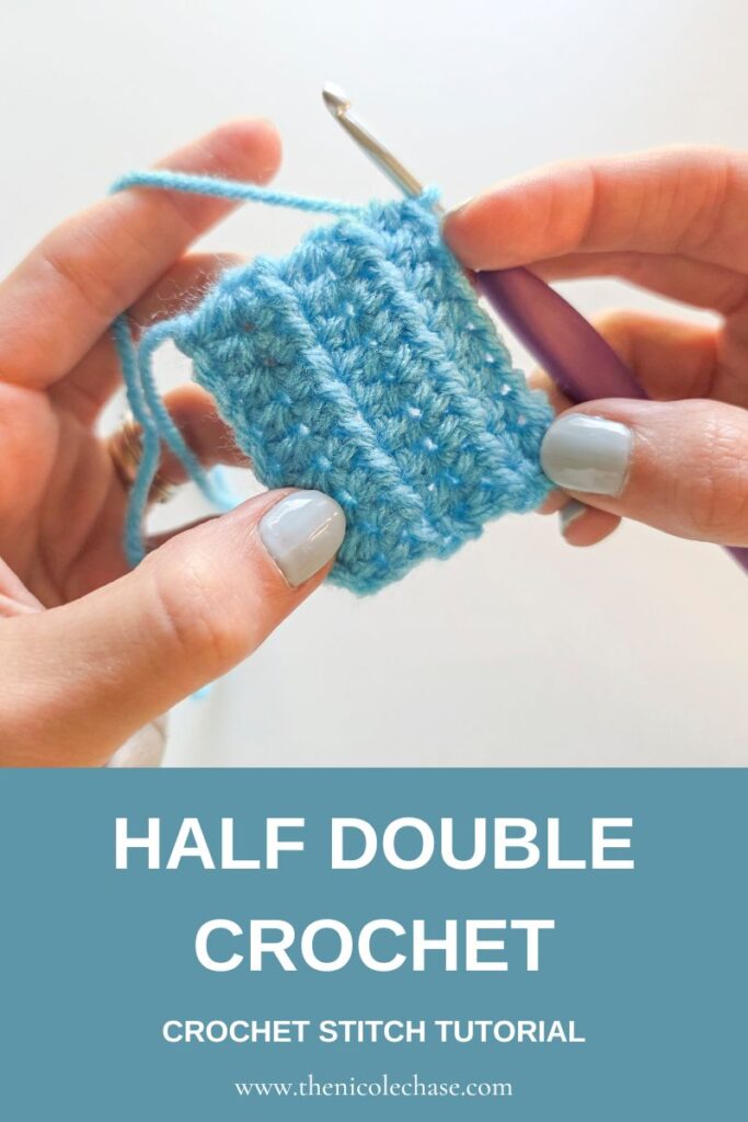 Pinterest pin graphic for a tutorial on how to do the half double crochet stitch, showing an image of hands holding a blue swatch of half double crochet stitches and a blue banner that reads "HALF DOUBLE CROCHET, CROCHET STITCH TUTORIAL", and the web address. 